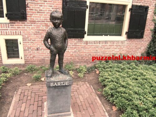 Van welke romanheld staat een standbeeld in assen (6)